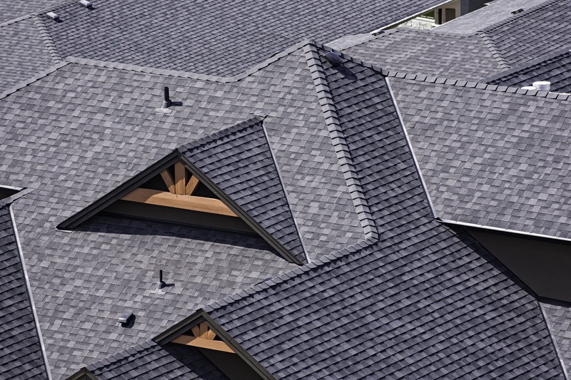 Close-up of architectural shingles showing layered texture and dimensional design